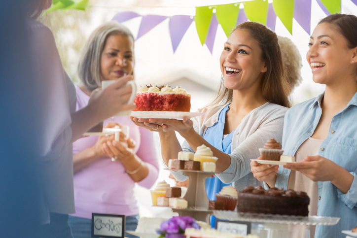 a group of women doing a cake bake fundraiser